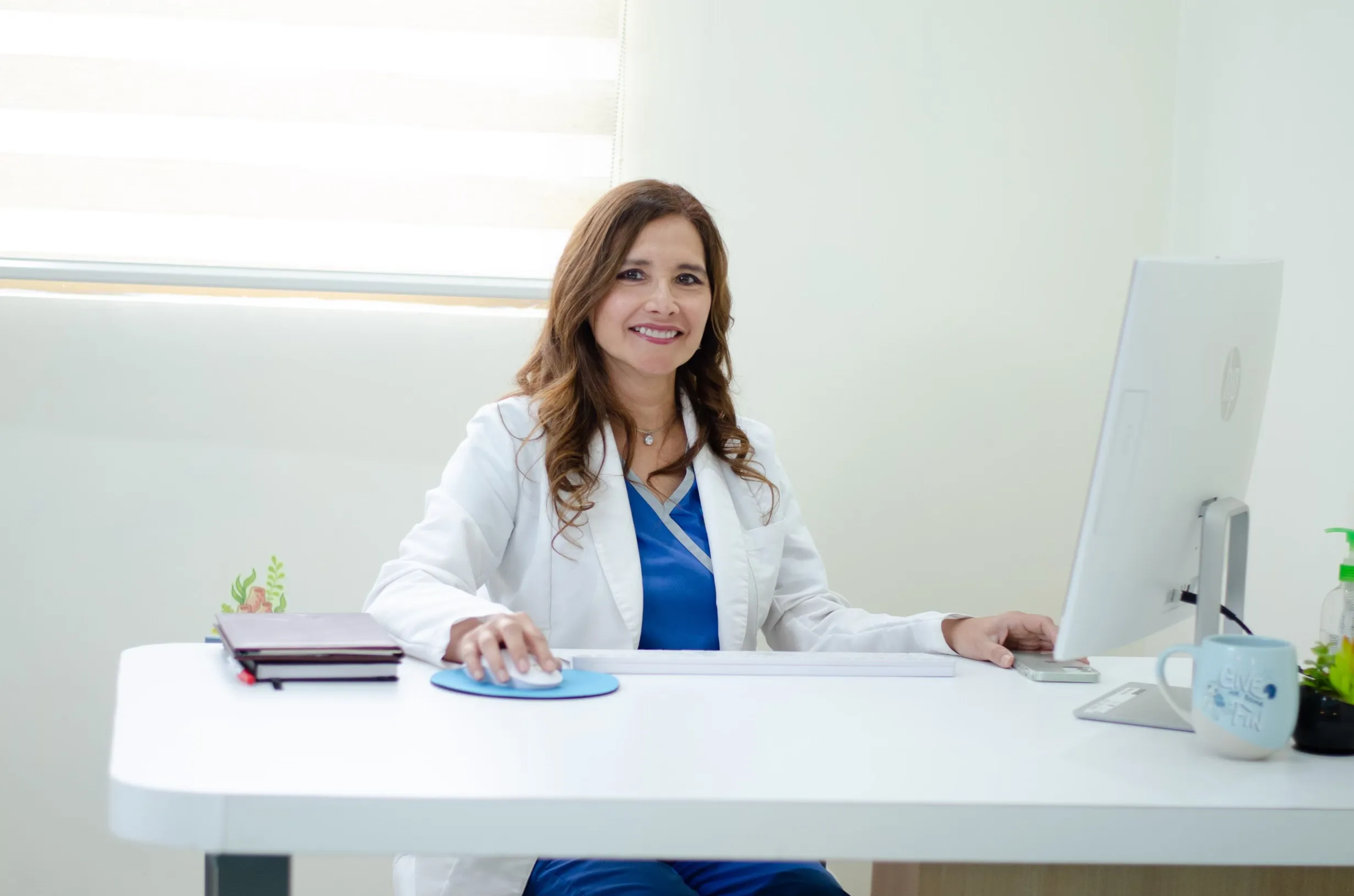 Dr. Rocio Moreno smiling at her desk
